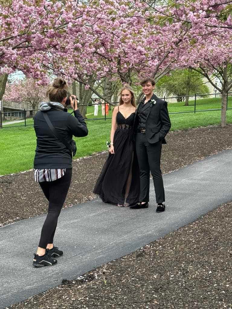 Photographer Betsy capturing moments during photo session